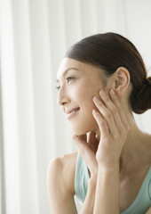 A woman taking care of her face