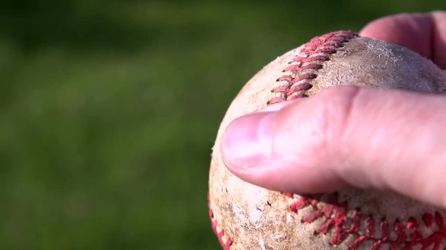 Person holding baseball in hand. Shot at 240fps
