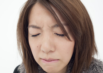 Fototapeta premium Young woman shedding tears