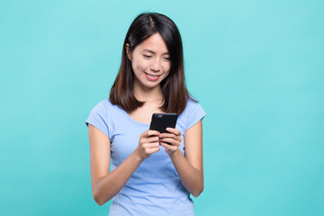Woman using cellphone online