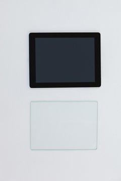 Close-up of digital tablet and glass sheet