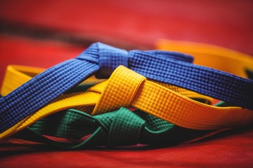 Blue, yellow and green karate belt