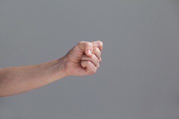 Close-up of clenched fist of a woman