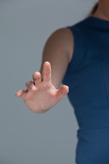 Obraz premium Hand of a woman touching invisible screen