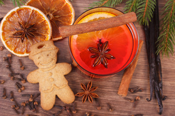 Mulled wine and gingerbread for christmas with spices and spruce branches