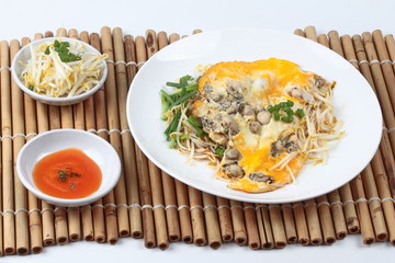 Oyster omelet with herb call Hoi Tod Khai in Thai .