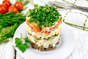 Salad with beef and tomato on table