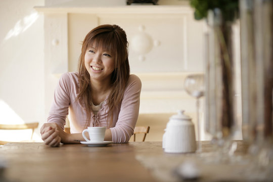 Smiling young woman at cafe