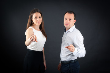 Beautiful couple doing different expressions in different sets of clothes: pointing