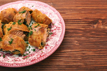 Salmon fillet and spinach with cheese baked in puff pastry