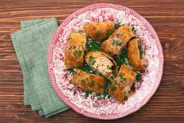 Salmon fillet and spinach with cheese baked in puff pastry