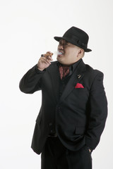 A man in suit smoking a cigar