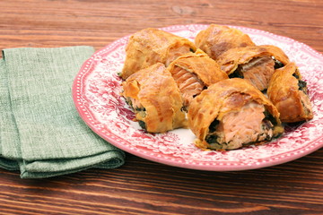 Salmon fillet and spinach with cheese baked in puff pastry