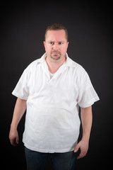 Fototapeta premium Handsome man doing different expressions in different sets of clothes: angry