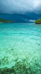 Fototapeta na wymiar Beautiful Blue Lagoone shortly before Thunderstorm, Gam Island, West Papuan, Raja Ampat, Indonesia