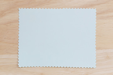 Blue notepad paper crumpled of empty and copy space on wooden ba