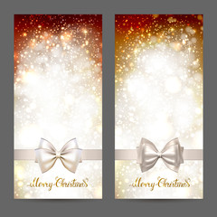 Two festive greeting cards with ribbon bow and shine gold inscription Merry Christmas. Glittering holiday Xmas greeting cards set.
