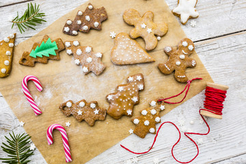 Homemade Christmas gingerbread cookies on wooden rustic background. 

