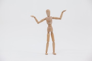 Wooden figurine standing with arms spread