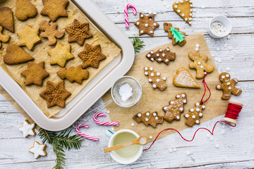 Homemade Christmas gingerbread cookies on wooden rustic background. 
