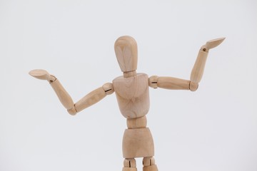 Wooden figurine standing with arms spread