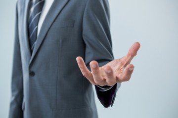 Businessman making hand gesture