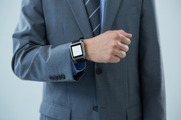 Businessman showing his smartwatch