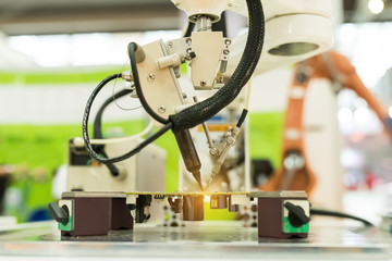 Robotic arm at production line in factory