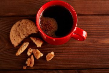 Coffee and Homemade cookies with chocolate. Handmade Chocolate cookies and cup of espresso on wooden table. Pile of delicious chip cookies. Christmas cookies. Biscuits. Oat biscuits.