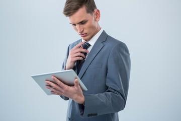 Businessman looking at digital tablet