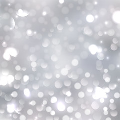 blurred silver bokeh background with soft lilac and pink colors. Holiday lights 