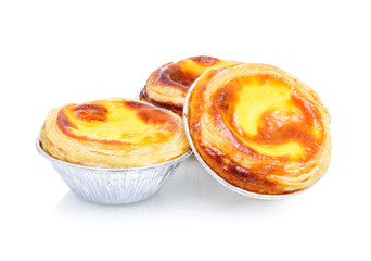 Egg tart sweet custard pie in foil cup isolated on white backgro