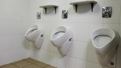 urinals in a public toilet