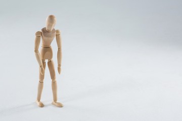 Wooden figurine on white background