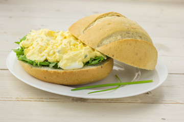 White sandwich with egg and chive salad