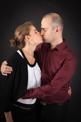 Beautiful couple doing different expressions in different sets of clothes: kiss