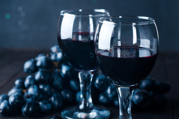 Red wine in glasses with grape