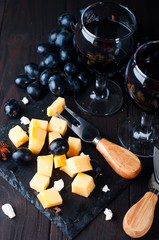 two glasses of red wine and cheese