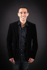 Obraz premium Handsome man doing different expressions in different sets of clothes: smile