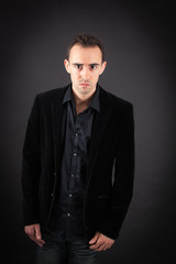 Fototapeta premium Handsome man doing different expressions in different sets of clothes: angry