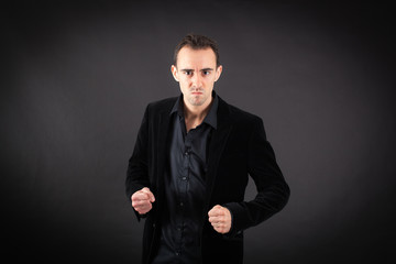 Handsome man doing different expressions in different sets of clothes: angry