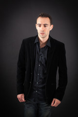 Obraz premium Handsome man doing different expressions in different sets of clothes: sad