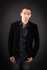 Fototapeta premium Handsome man doing different expressions in different sets of clothes: tired