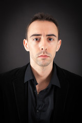 Obraz premium Handsome man doing different expressions in different sets of clothes: thinking