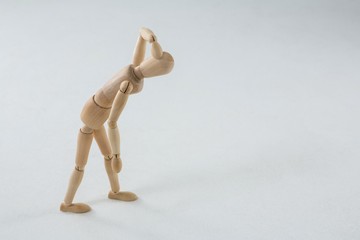 Injured figurine with hand on head