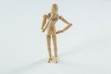 Tensed wooden figurine standing