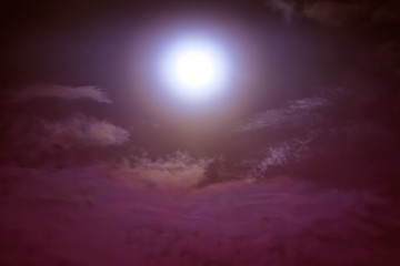 Nighttime sky with clouds and moonlight with shiny.