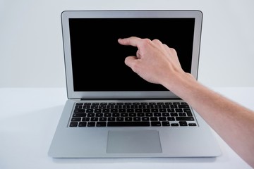Fototapeta na wymiar Man pointing at laptop