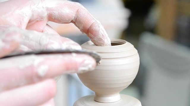 Making Forming Lines Small Raw Wet Clay Pot Vase Vessel Close-up Macro. Art Creative Process Creation Of White Clay. Creator Crock. Caucasian Man Making Vessel Clay In Fast Circle. Ukraine,traditions.