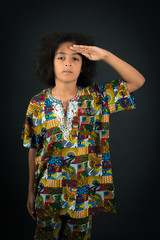 Fototapeta premium Handsome boy doing different expressions in different sets of clothes: at attention